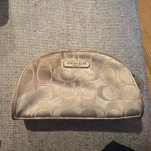 Small Coach makeup bag with normal wear and tear